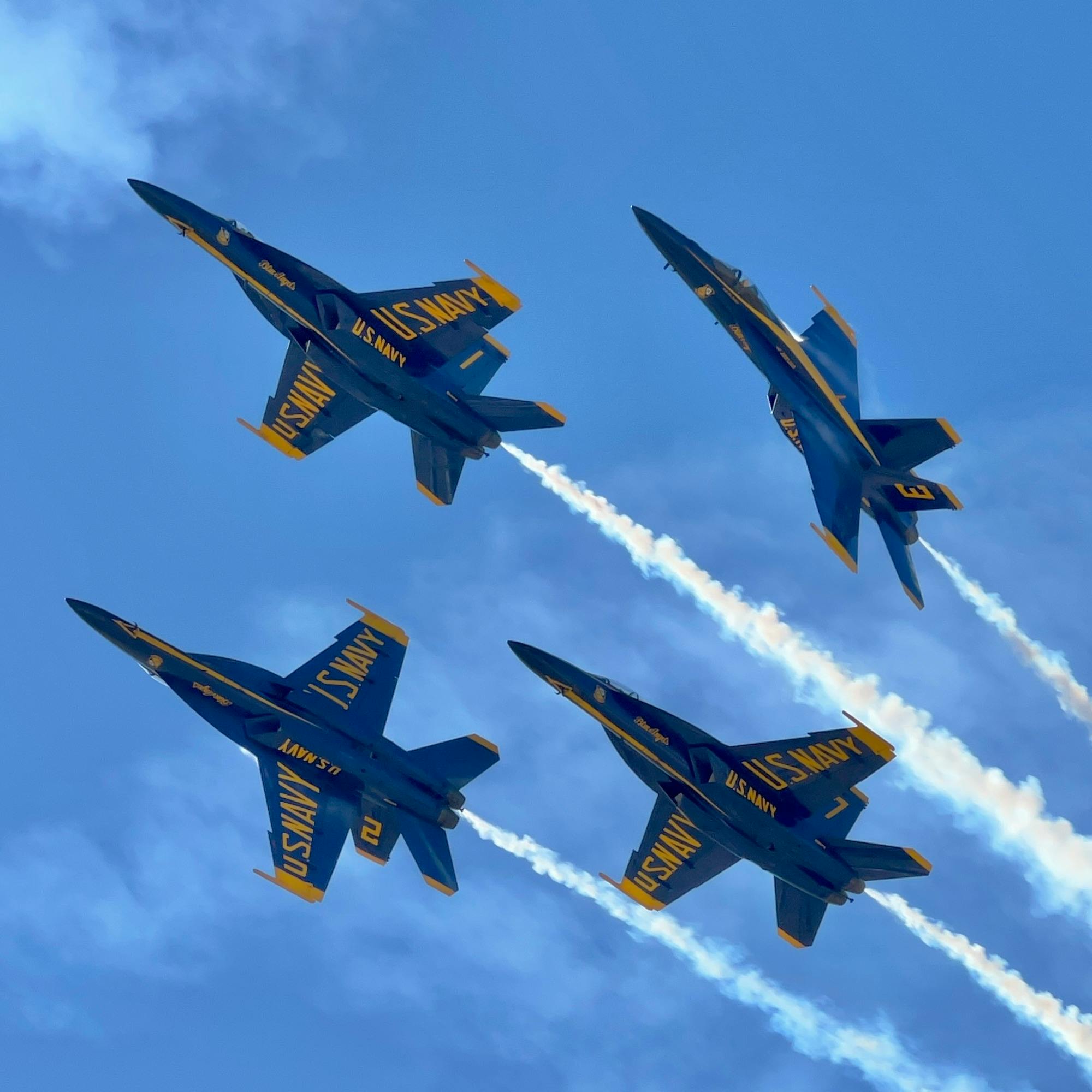 Blue Angels flying in diamond formation during an airshow in San Diego.